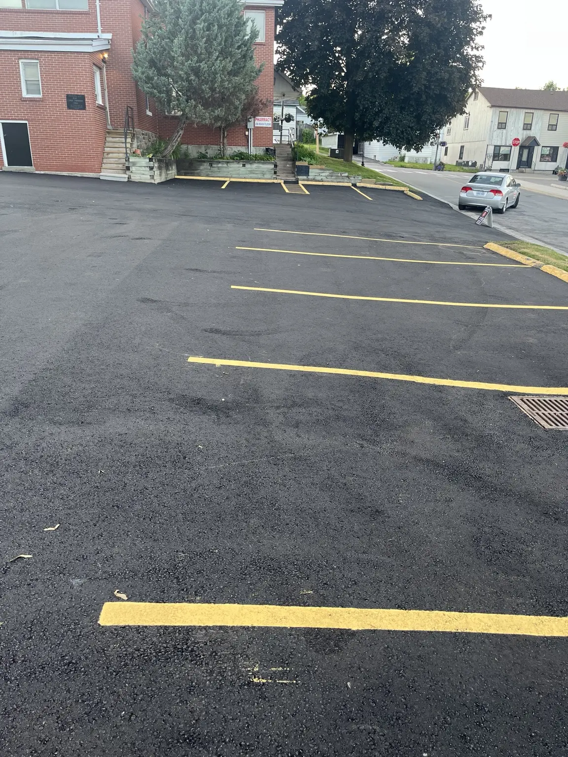 Refreshed yellow parking lines across a commercial lot
