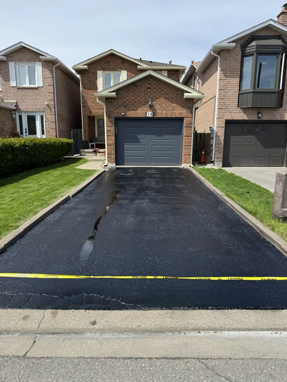 Black sealed residential driveway improving curb appeal