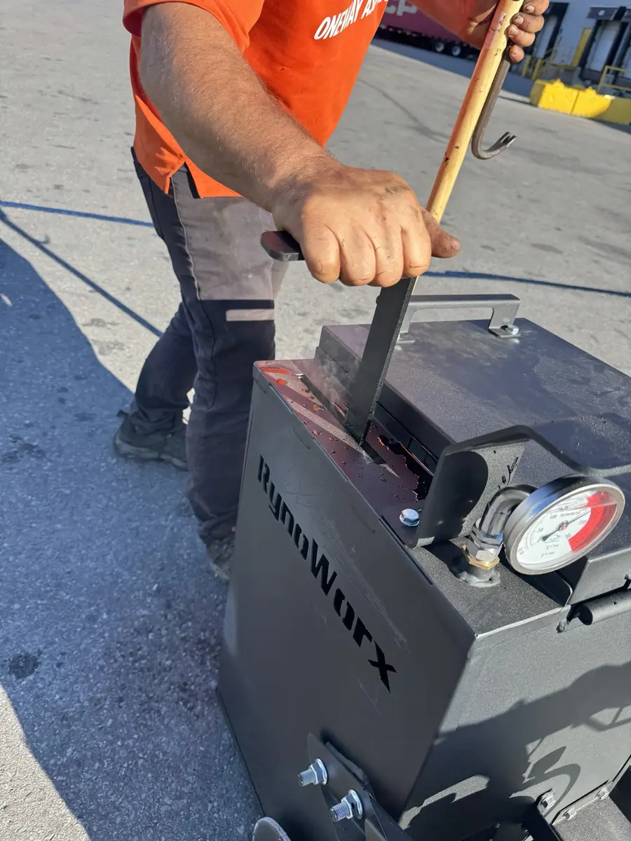Commercial hot-rubber crack-filling equipment operated by Oneway Asphalt Seal