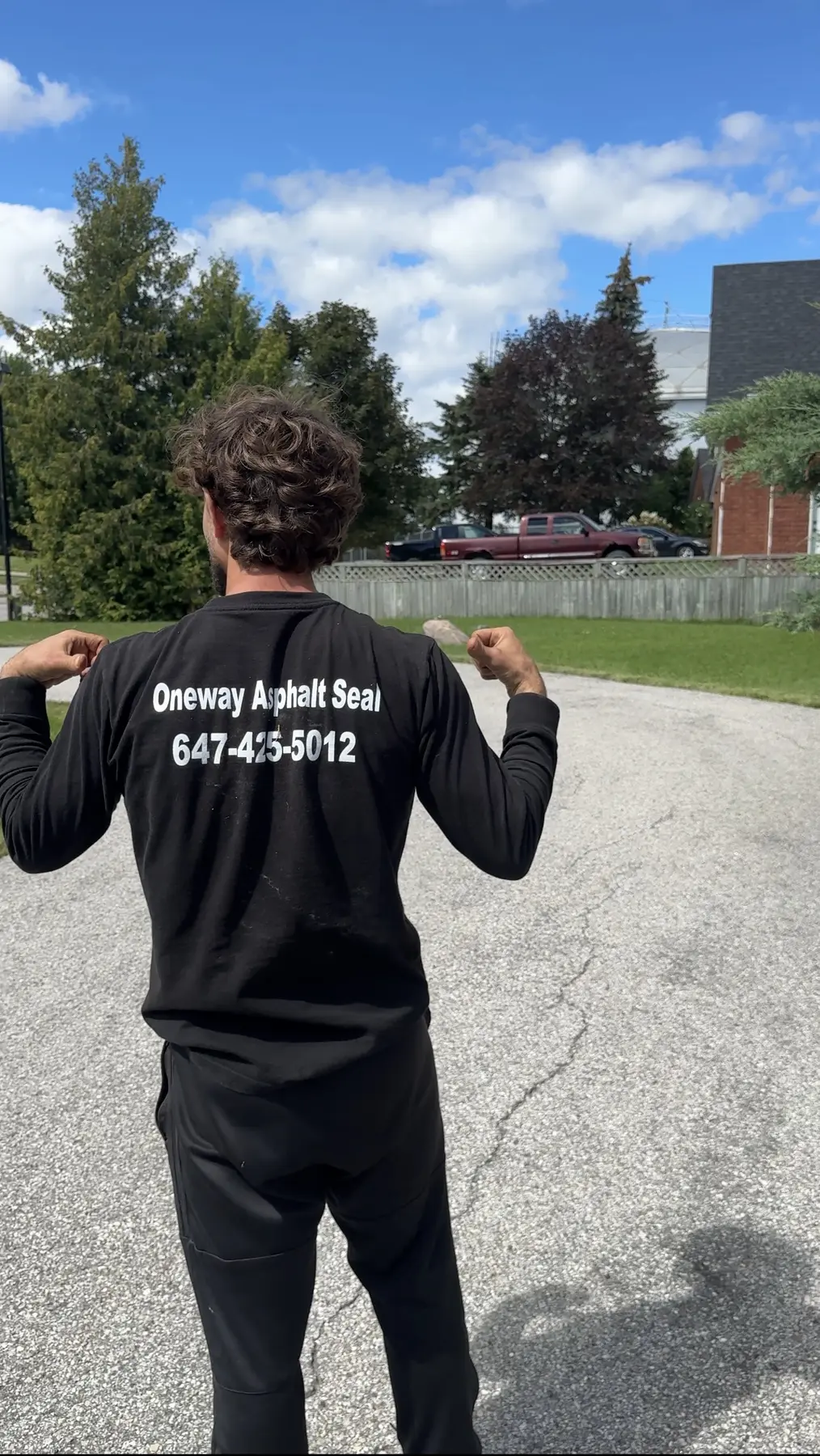 Oneway Asphalt Seal crew member wearing branded work clothing